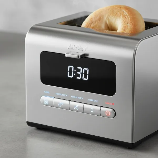 Digital display of All-Clad toaster showing countdown and mode selection buttons.