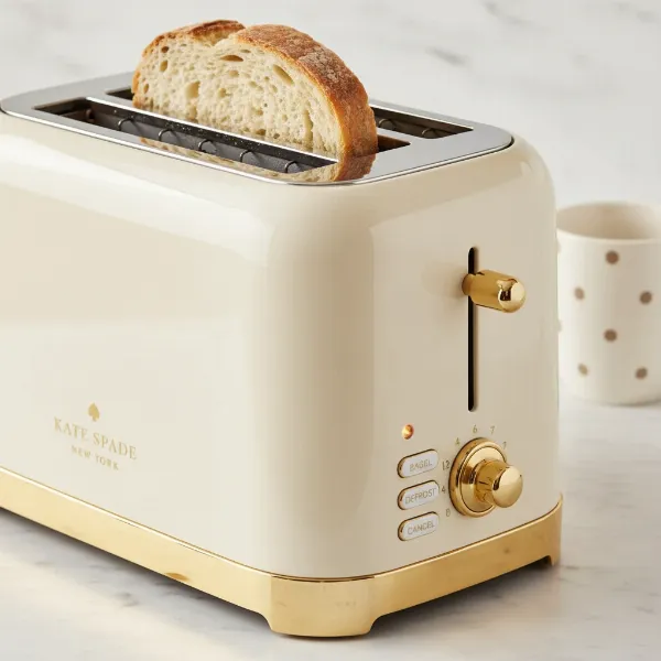 Close-up of Kate Spade toaster showing wide slots and control dial.