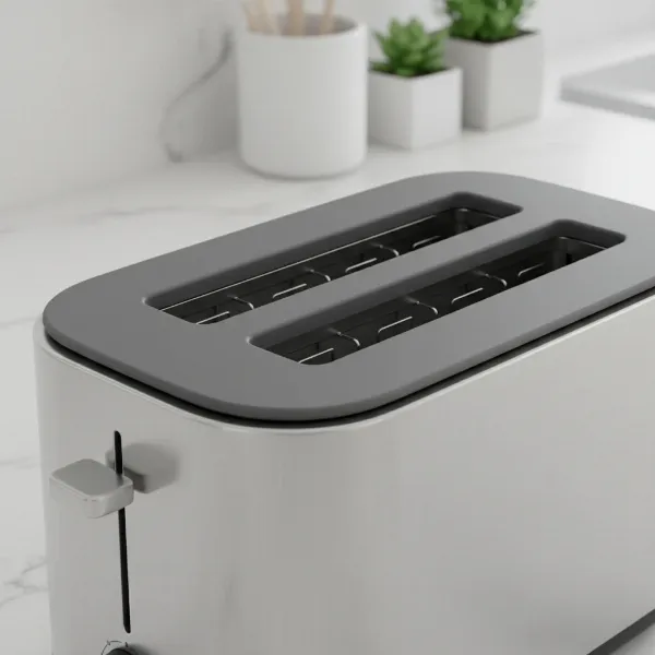 A minimalist gray silicone lid precisely covering the slots of a contemporary stainless steel toaster.