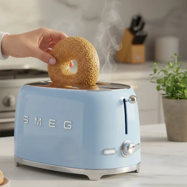 Smeg 2-slice toaster with a bagel being toasted, illustrating its specialized bagel mode.